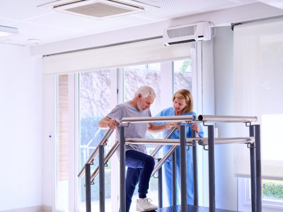 Physiotherapist assisting a patient during rehabilitation